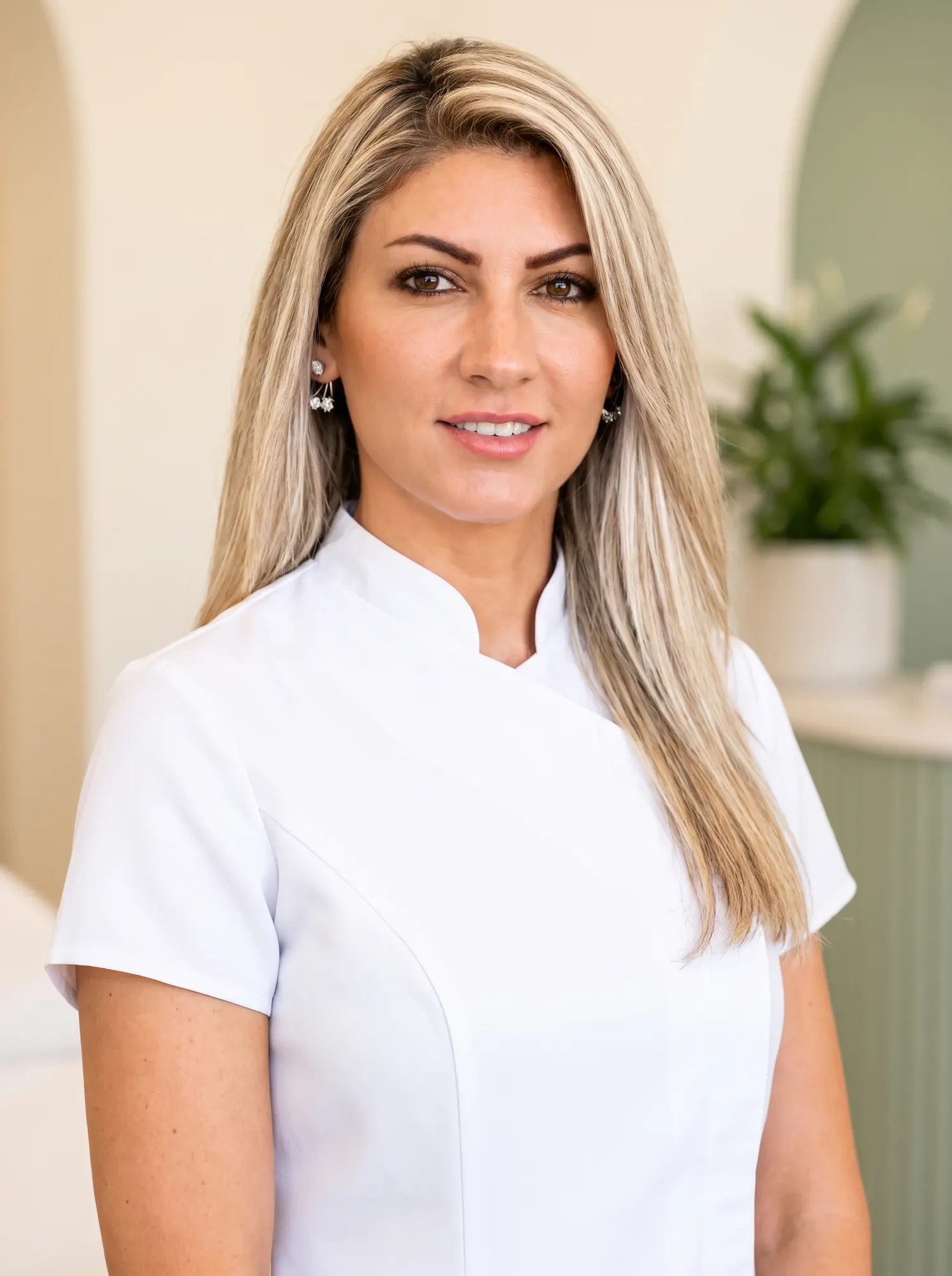 Faten Asaad, Senior Treatment Consultant, in a white clinical tunic